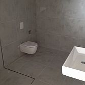 Referentie: Complete badkamer (vloer en wandtegels) klant uit Amsterdam