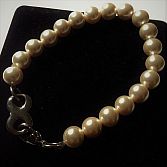 Schitterende parelmoer as-armband met infinity sluiting